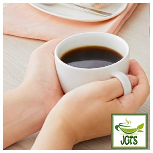 Nescafe Gold Blend Black Caffeine Half Instant Coffee - Box and cup of coffee