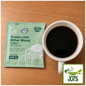 Top Value . Aroma Rich Bitter Blend Drip Coffee - Single drip coffee packet and cup of coffee
