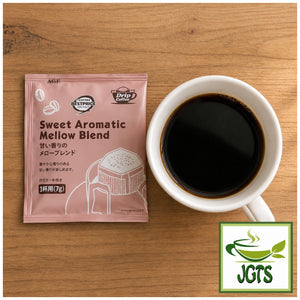 Top Value . Sweet Aromatic Mellow Blend Drip Coffee - single drip coffee packet and cup of coffee