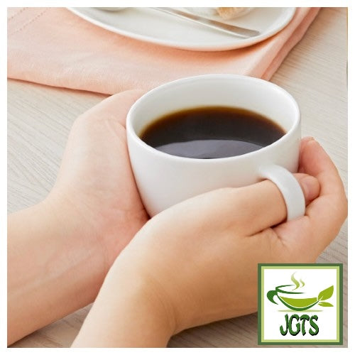 Nescafe Gold Blend Black Caffeine Half Instant Coffee - Box and cup of coffee