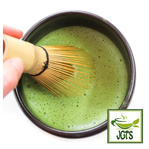 Powder Uji Matcha - Matcha being whished in a matcha bowl 