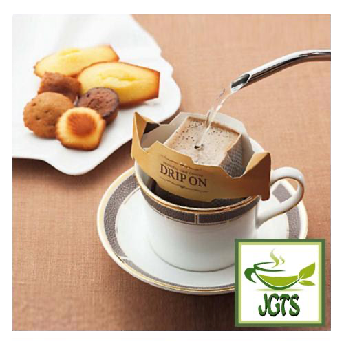 Key Coffee Drip On Variety Pack Ground Coffee 12 Pack - Drip coffee brewed in cup with snacks